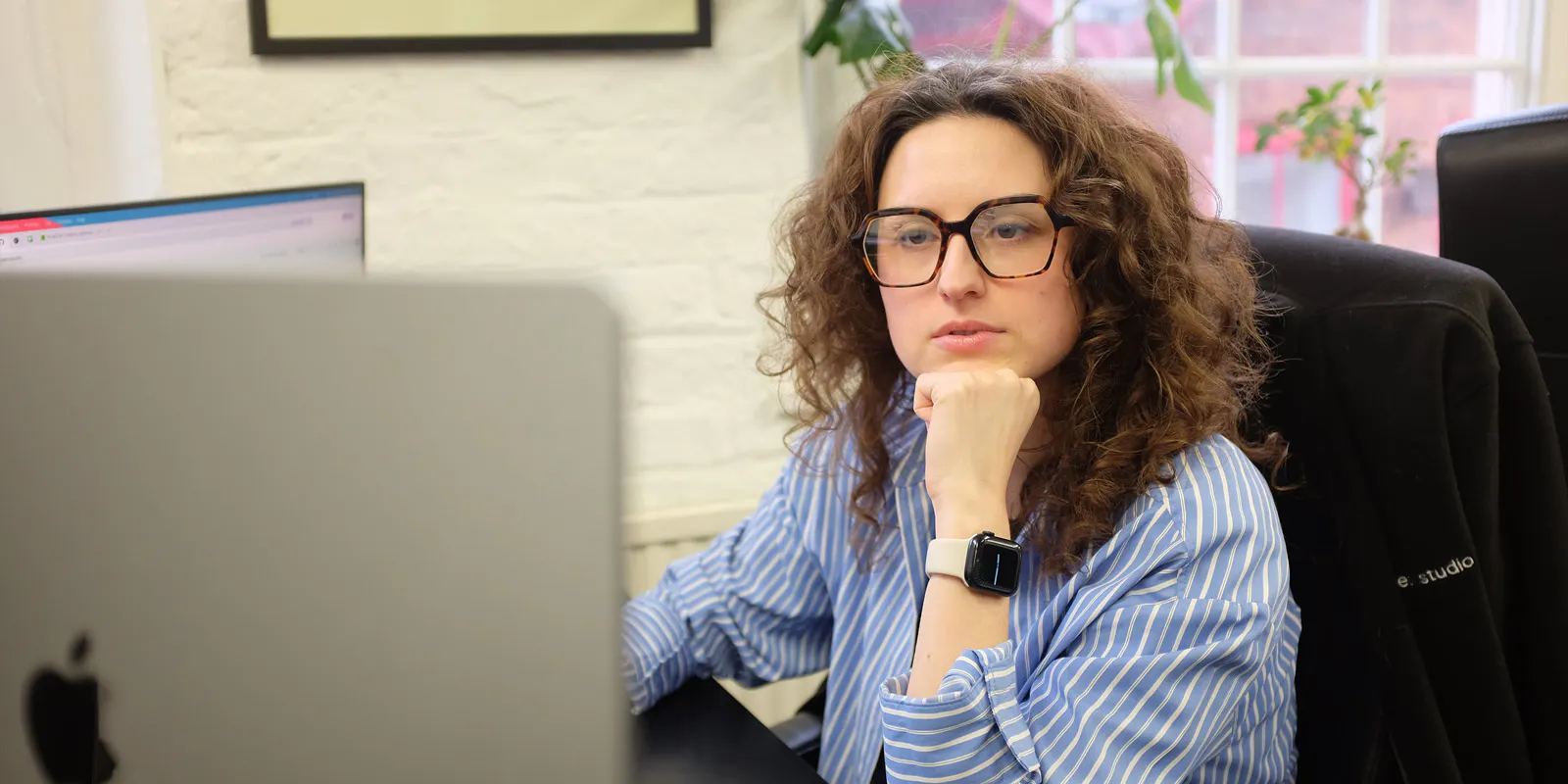 Woman looking at a computer