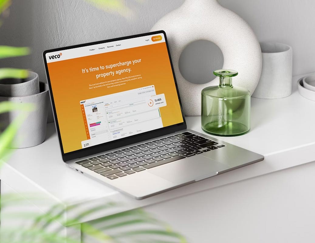 Laptop with the Veco Plus website home page
