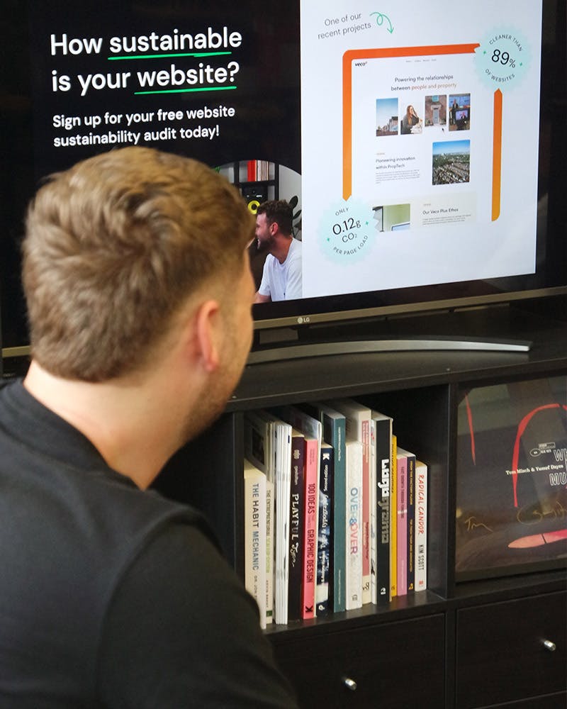 Man looking at TV with campaign on
