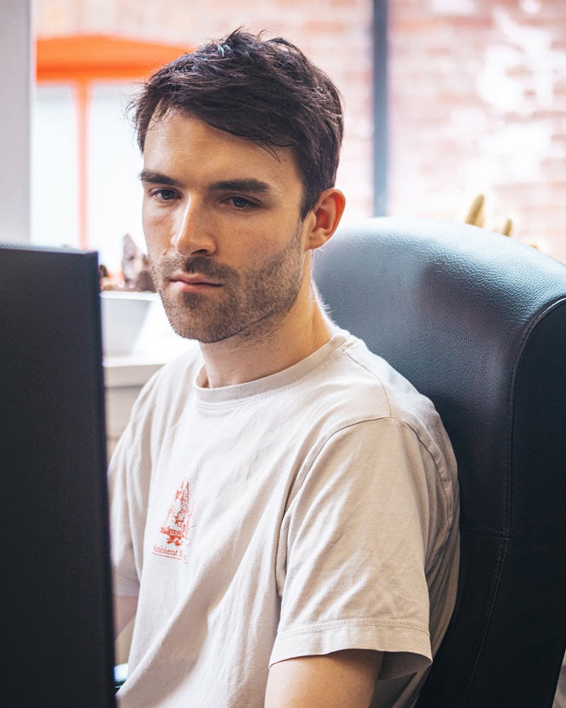 Man in thought at computer