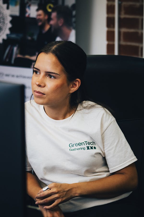 Women in thought looking over computer