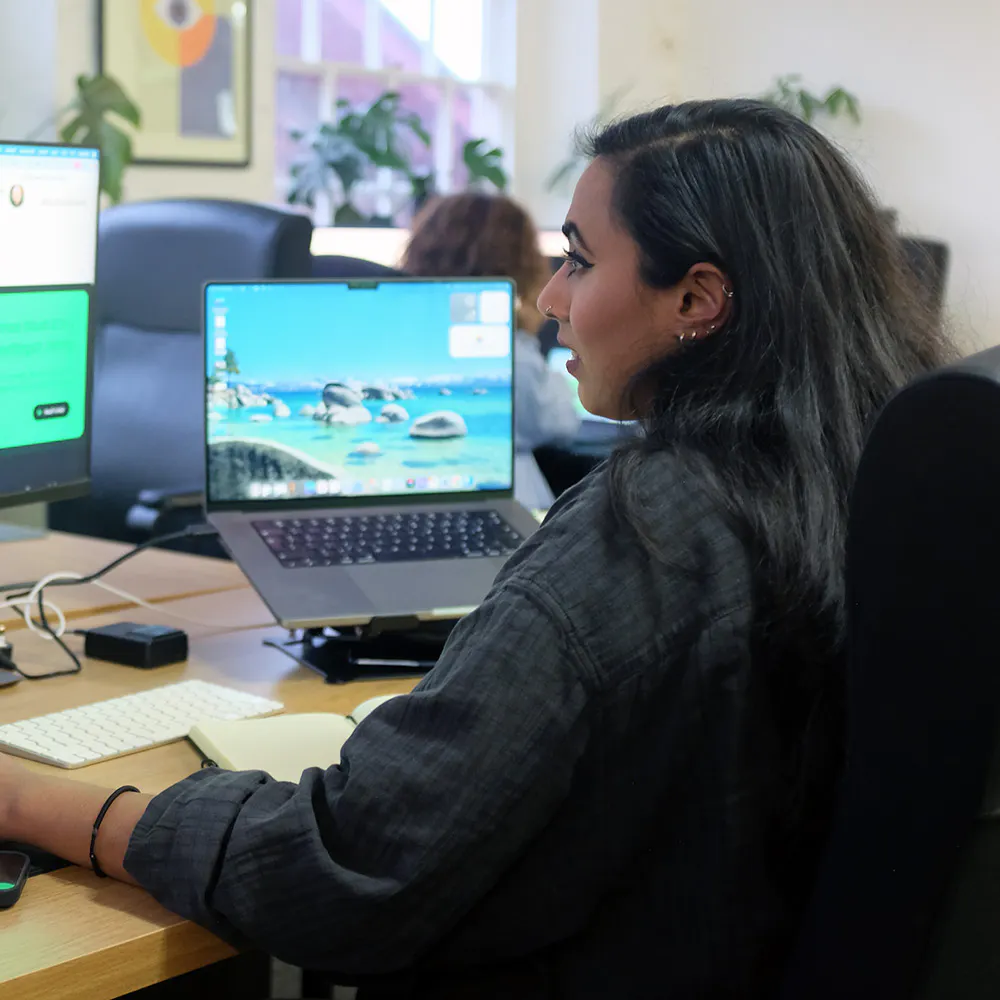 Woman working at computer square